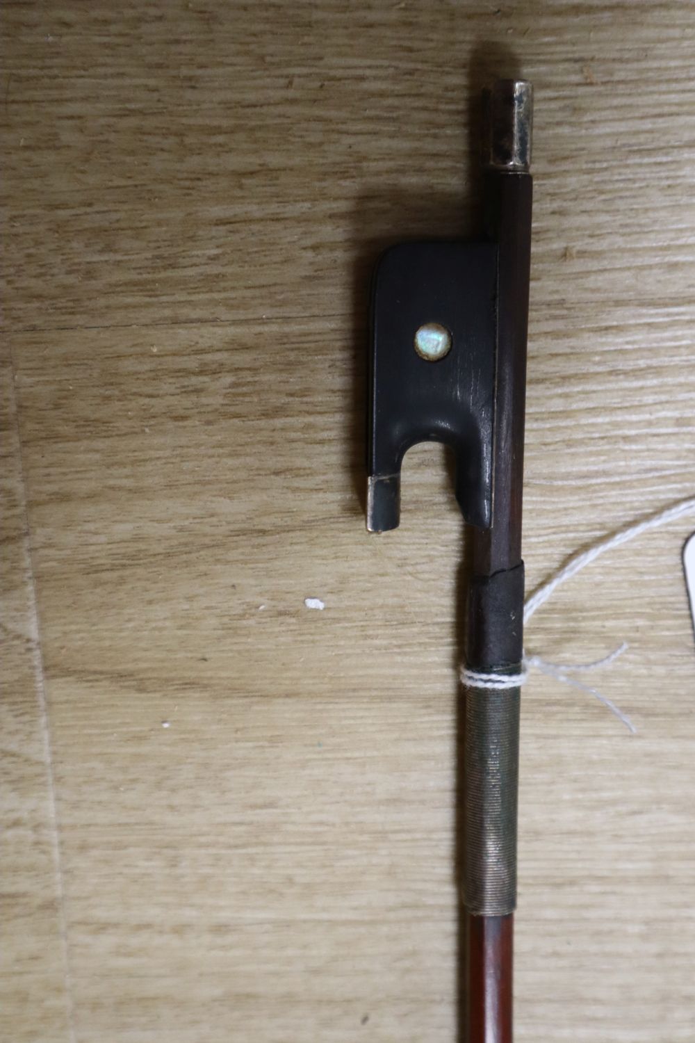A silver-mounted violin bow, unsigned, 29in.